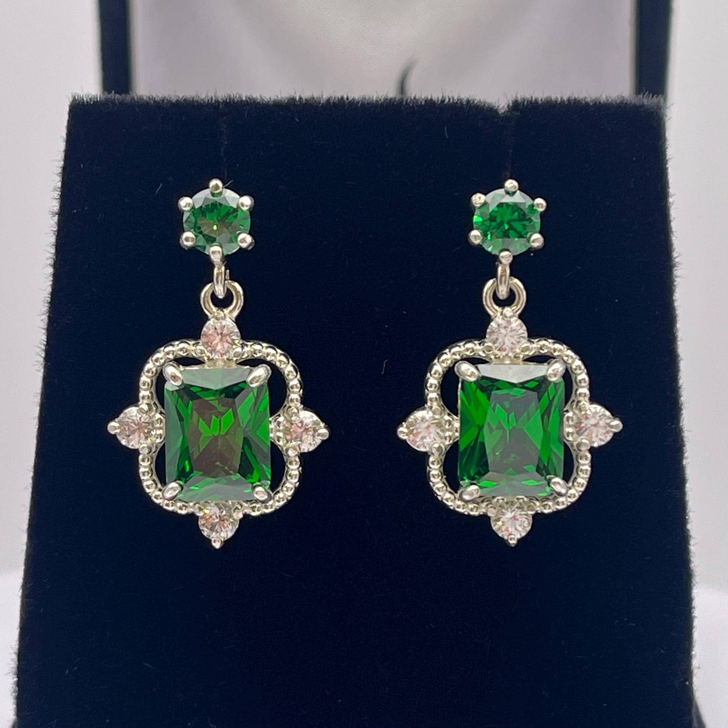 Gorgeous 10.4ctw Emerald Cut Emerald Earrings White Sapphire Accents