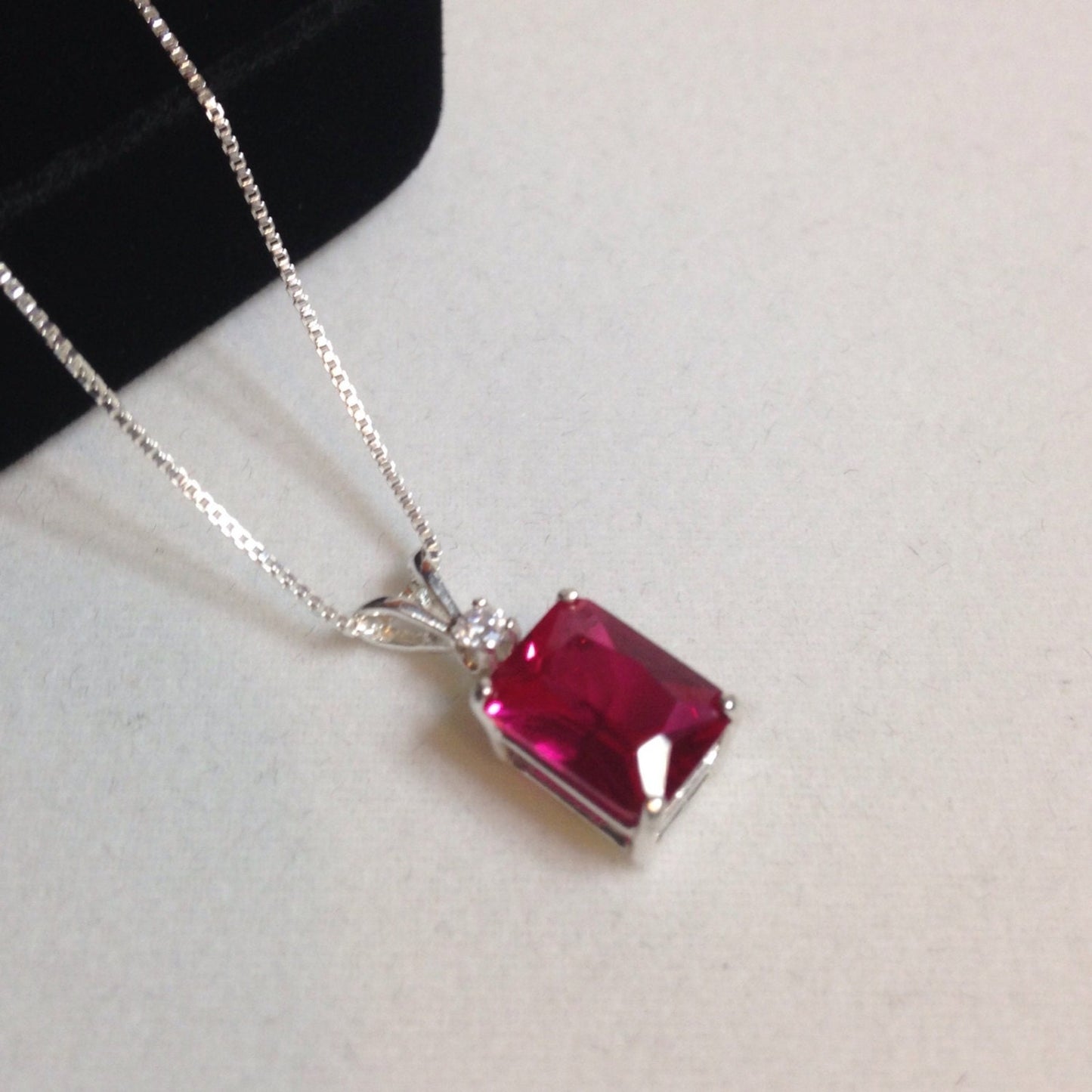 Beautiful Emerald Cut Ruby Necklace with White Sapphire accent