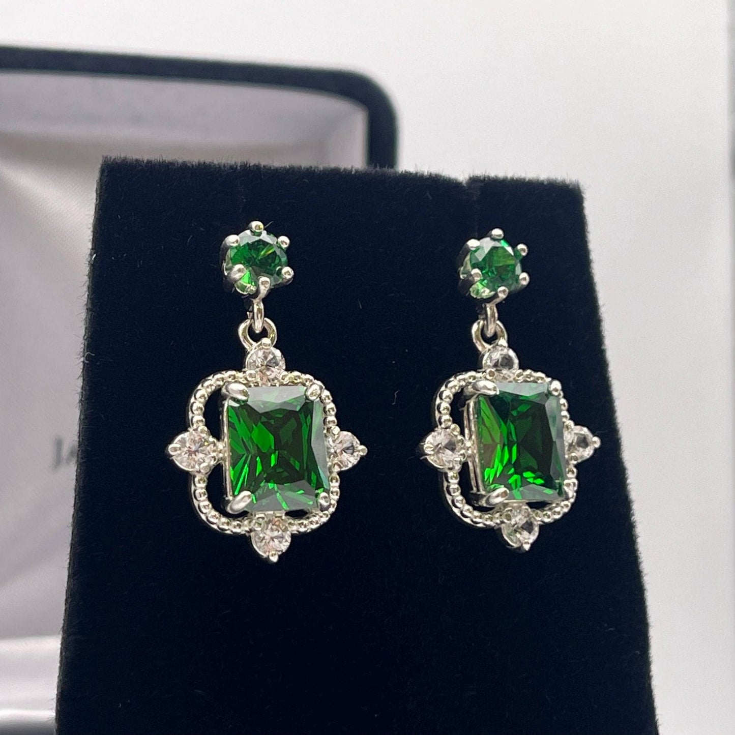 Gorgeous 10.4ctw Emerald Cut Emerald Earrings White Sapphire Accents
