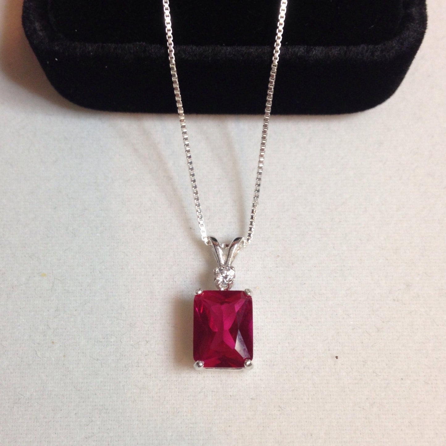 Beautiful Emerald Cut Ruby Necklace with White Sapphire accent