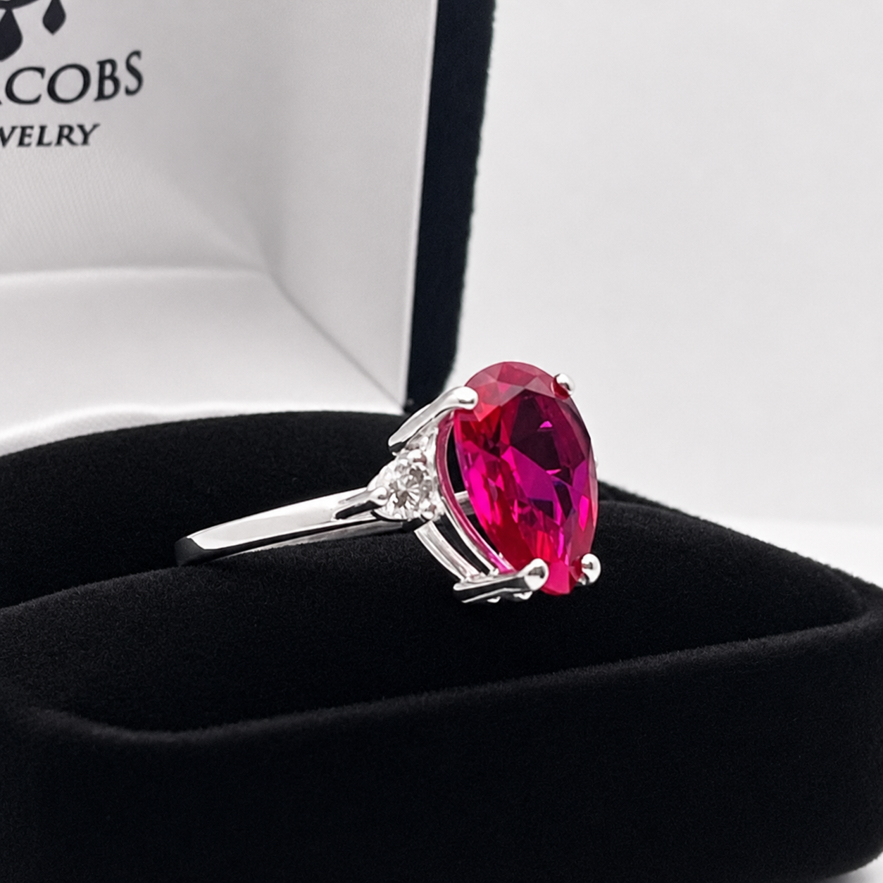 4.7CTW Pear Cut Ruby Ring with White Sapphire Accents