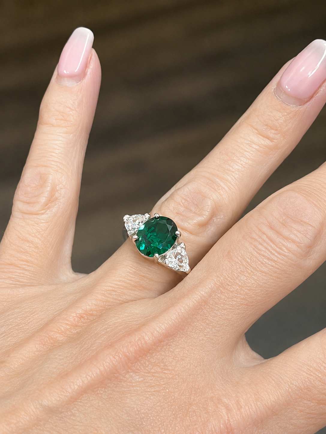 4ctw Oval Cut Lab Grown Emerald & Trillion White Sapphire Three Stone Ring