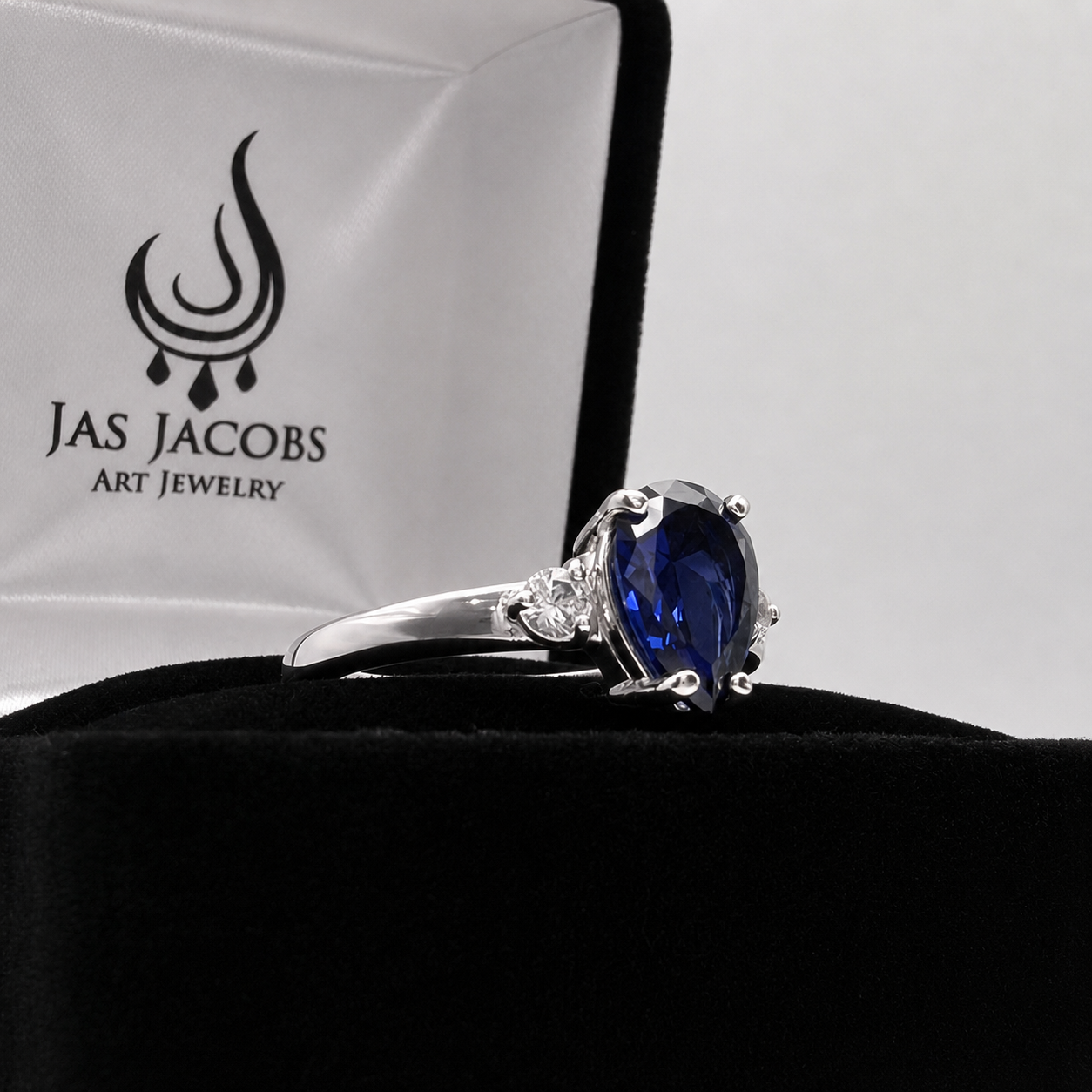 2.5CTW Pear Cut Sapphire Ring with White Sapphire Accents