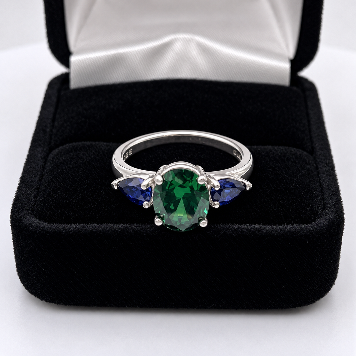 3.6ctw Oval Emerald & Pear Blue Sapphire Three Stone Ring