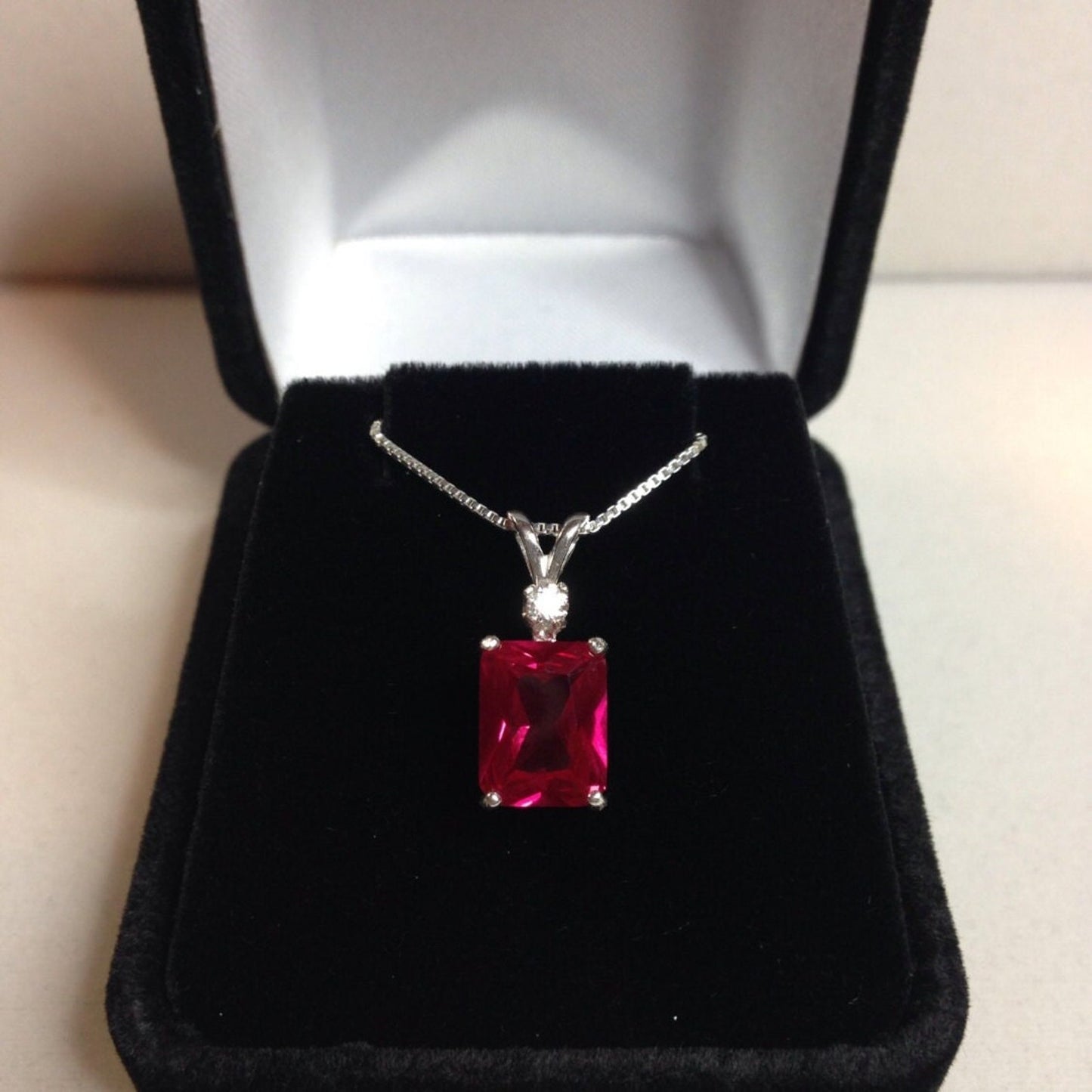 Beautiful Emerald Cut Ruby Necklace with White Sapphire accent