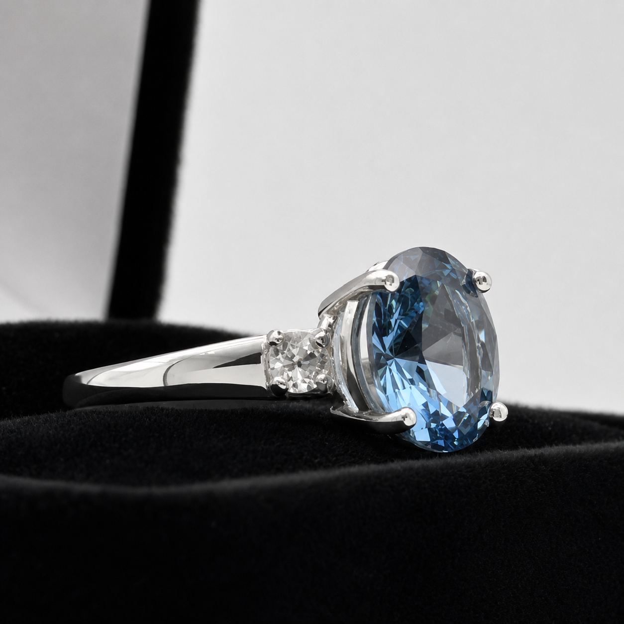 2.6CTW Oval Cut Blue Topaz Ring | White Sapphire Accents