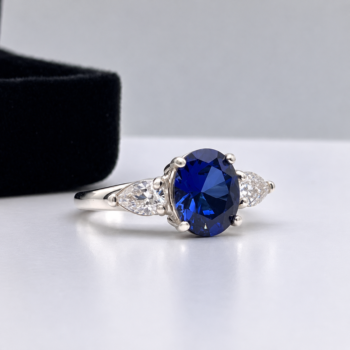 4.5ctw Oval Blue Sapphire & White Sapphire Three Stone Ring