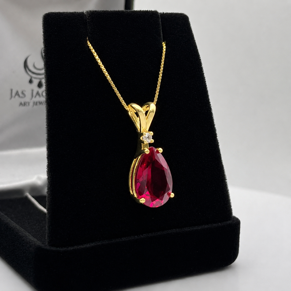 7.5ct Pear Cut Ruby Pendant Necklace with Diamond Accent in 14k Gold