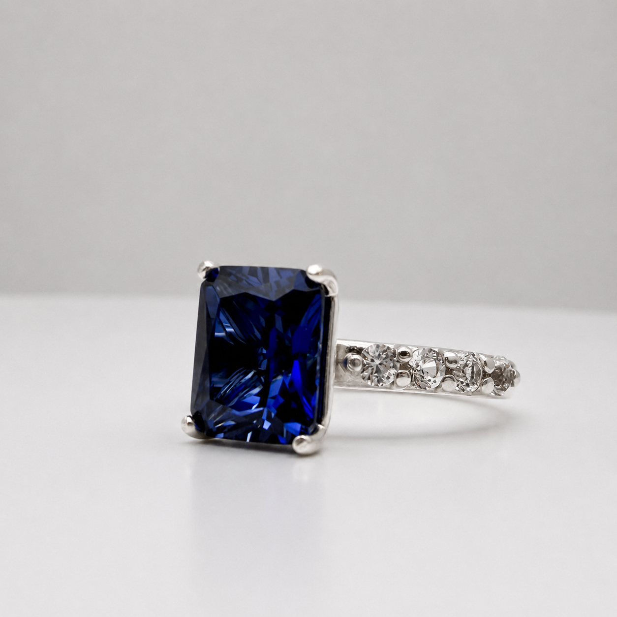 4.64 Carat Emerald Cut Blue Sapphire Ring with Diamond Accents