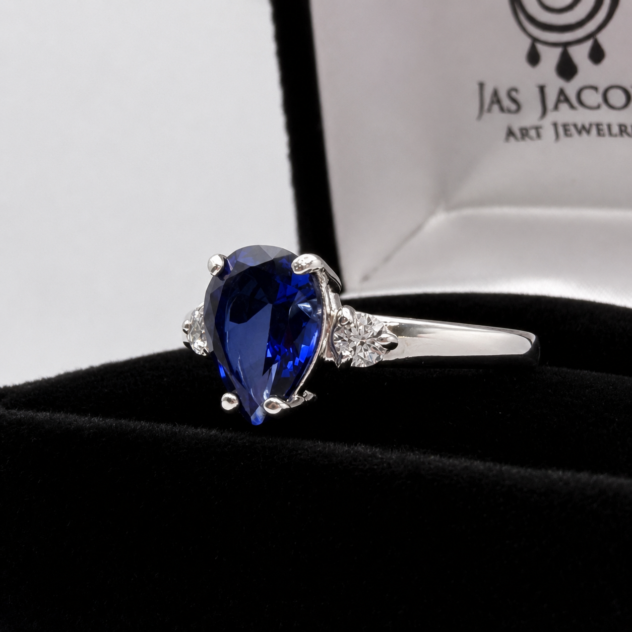 2.5CTW Pear Cut Sapphire Ring with White Sapphire Accents