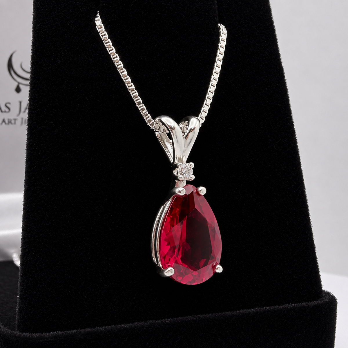 7.5ct Pear Cut Ruby Pendant Necklace with White Sapphire Accent in Sterling Silver