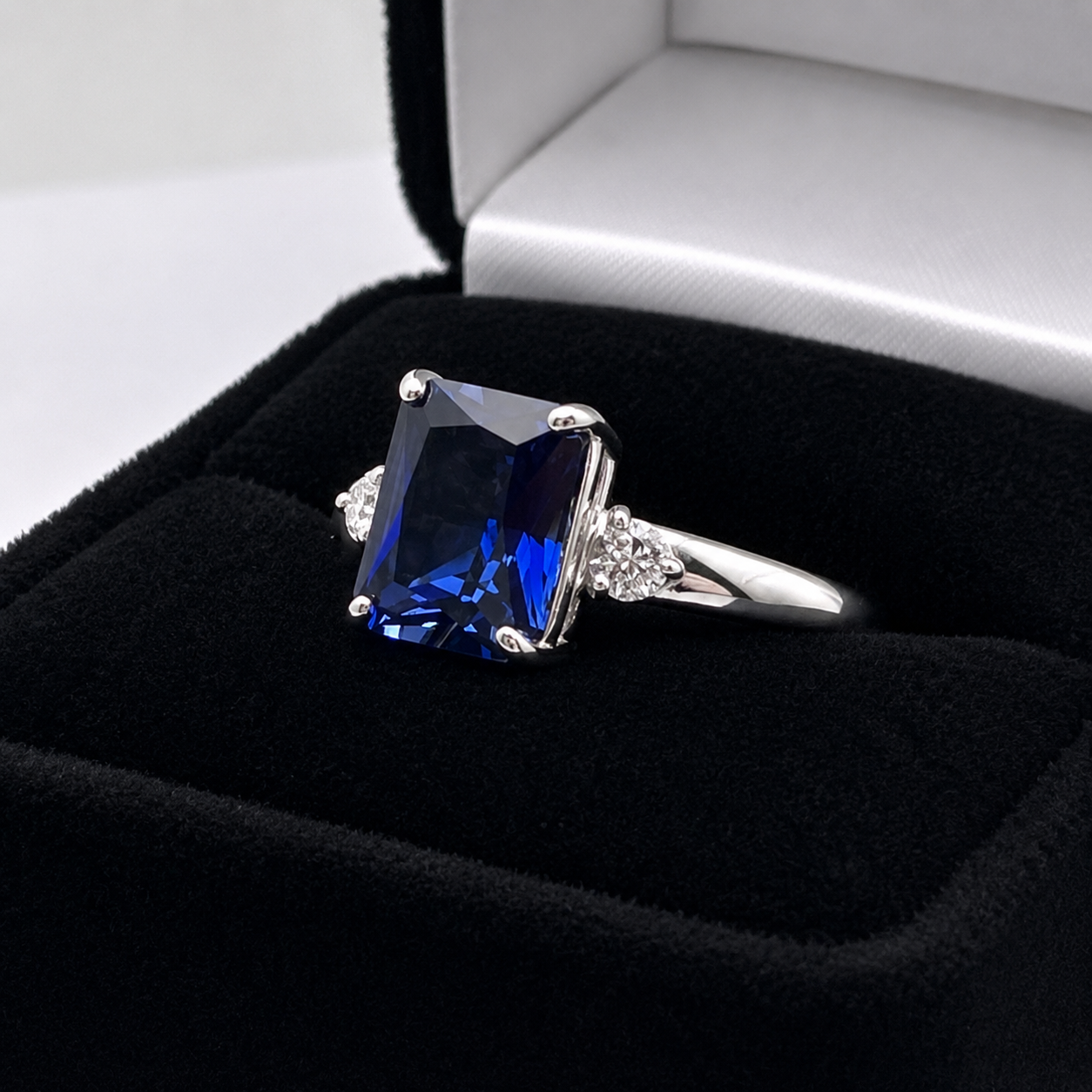 4 Carat Emerald Cut Blue Sapphire Ring with Diamond Accents