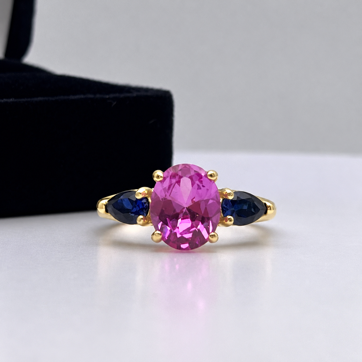 4.5ctw Oval Cut Pink & Blue Sapphire Three-Stone Ring