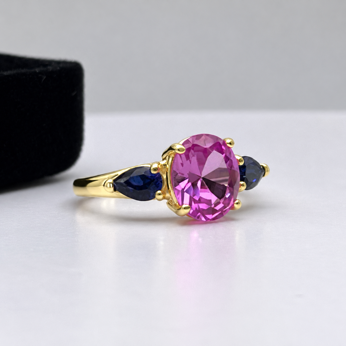 4.5ctw Oval Cut Pink & Blue Sapphire Three-Stone Ring