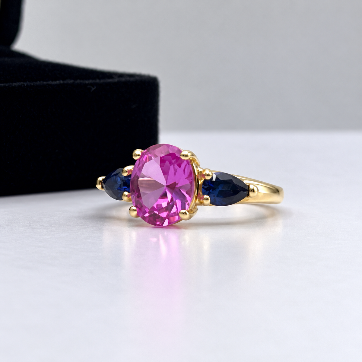 4.5ctw Oval Cut Pink & Blue Sapphire Three-Stone Ring
