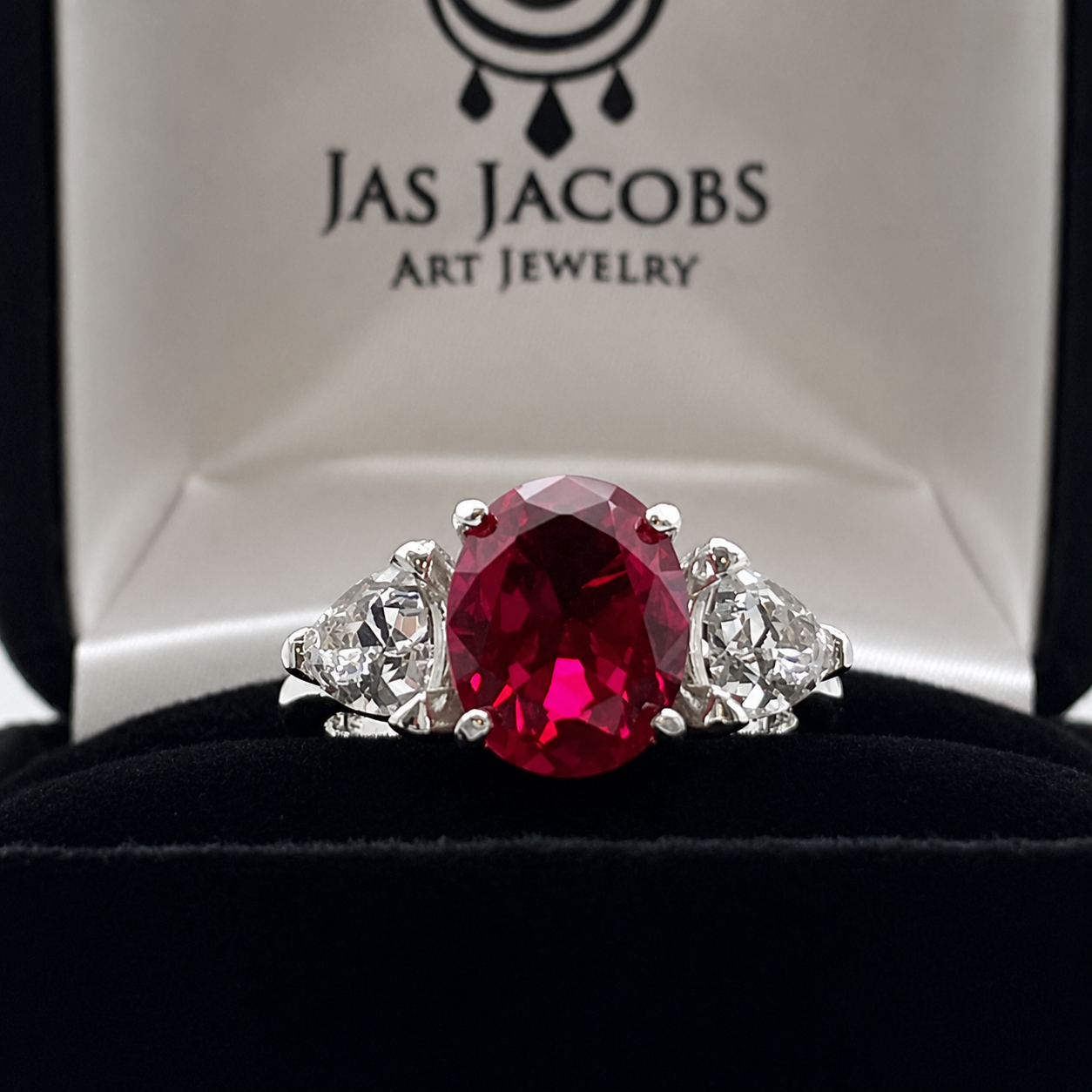 4.5ctw Oval Cut Ruby & Trillion Cut White Sapphire Three Stone Ring