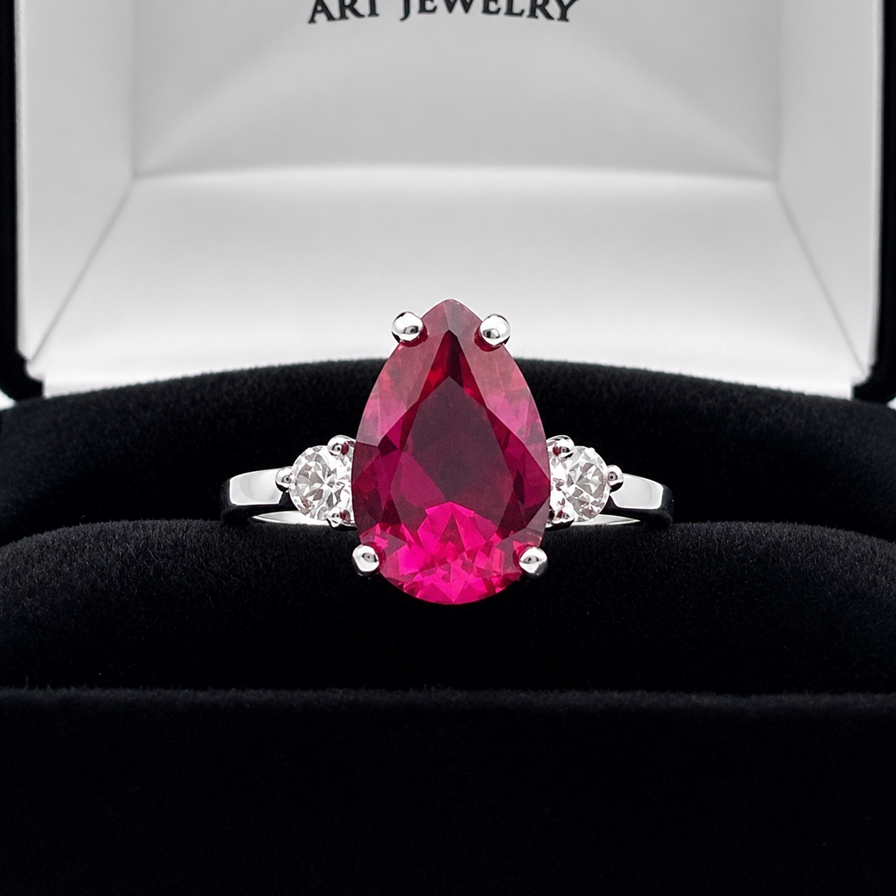 4.7CTW Pear Cut Ruby Ring with White Sapphire Accents