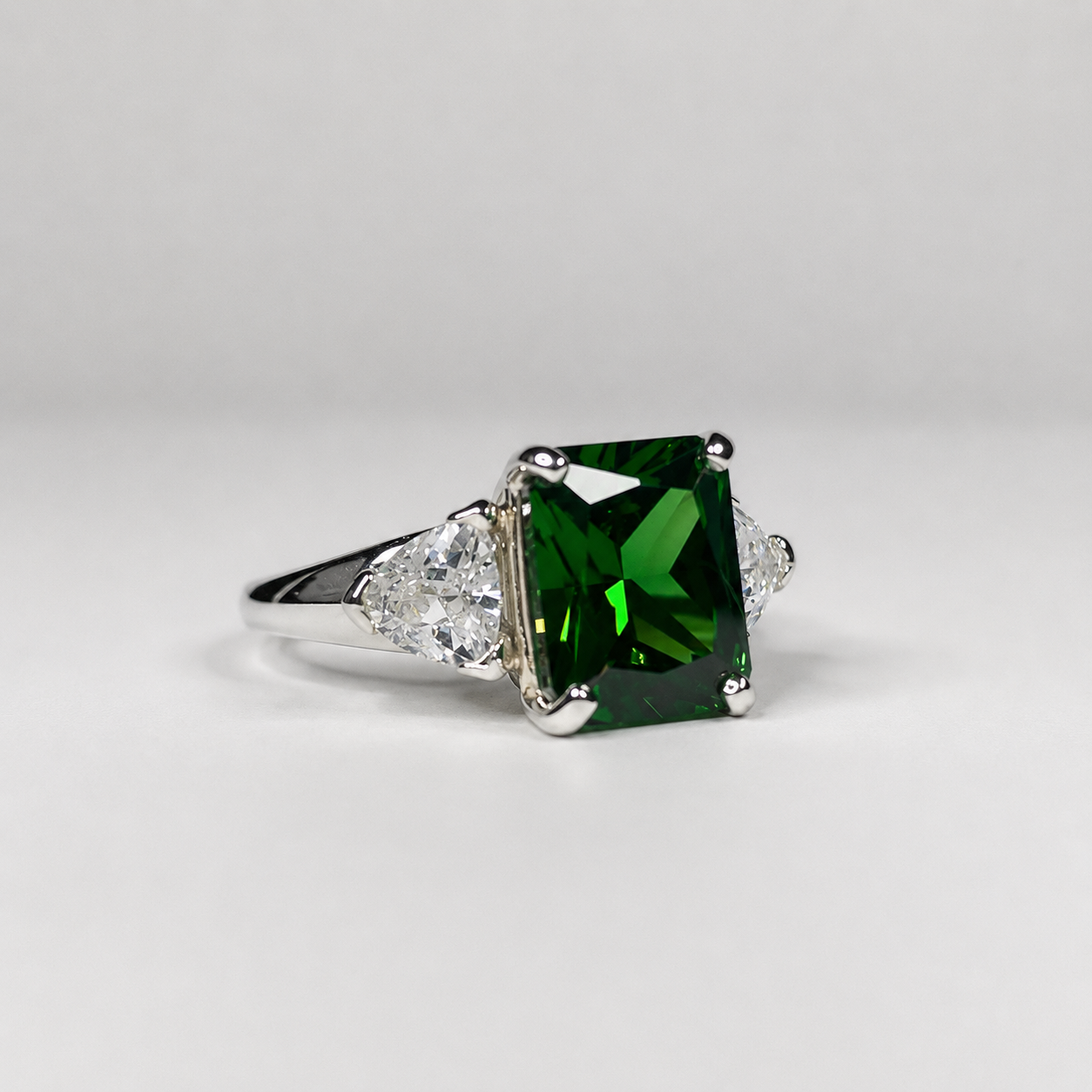 4.5CTW Emerald Cut Emerald Ring | Trillion White Sapphire Three Stone Ring
