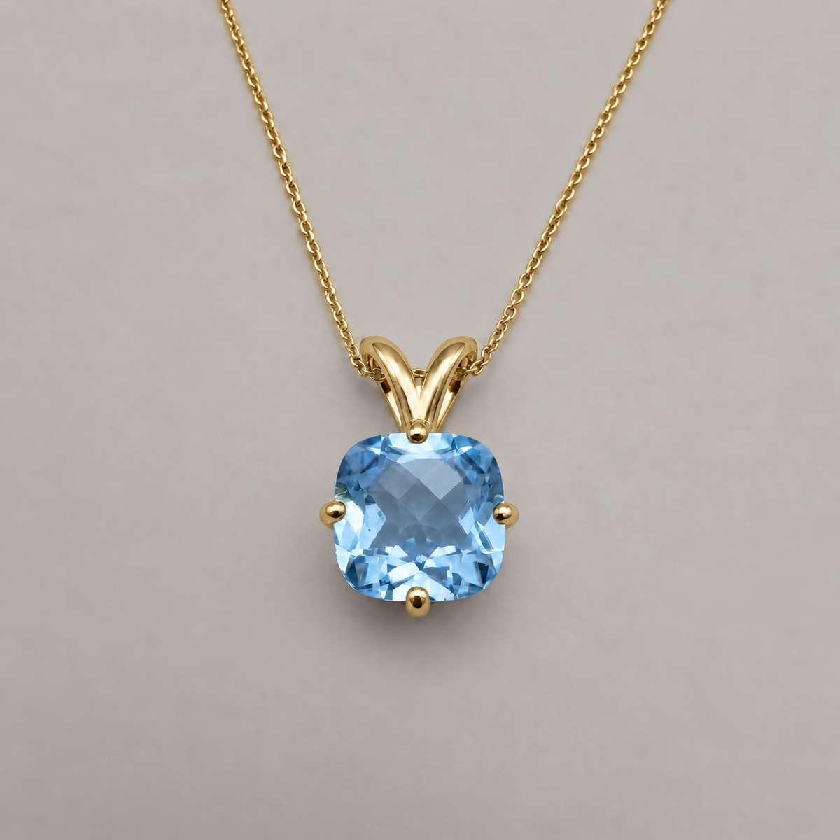 2.5ct Checkerboard Cushion Sky Blue Topaz pendant necklace in Yellow Gold