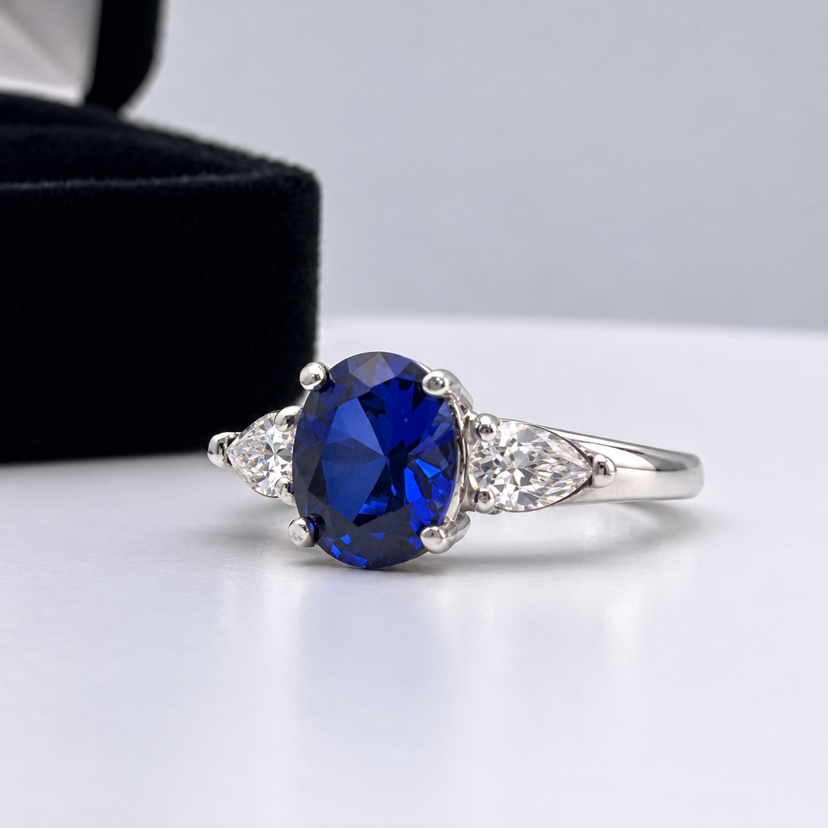 4.5ctw Oval Blue Sapphire & White Sapphire Three Stone Ring