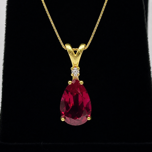 7.5ct Pear Cut Ruby Pendant Necklace with Diamond Accent in 14k Gold