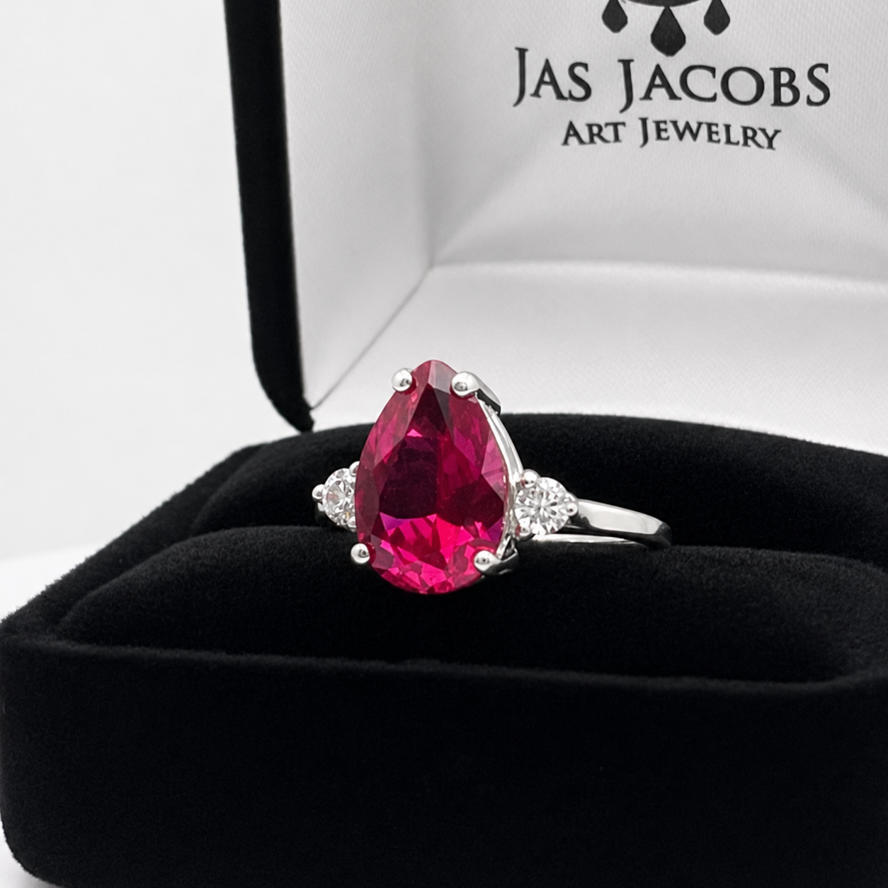 4.7CTW Pear Cut Ruby Ring with White Sapphire Accents