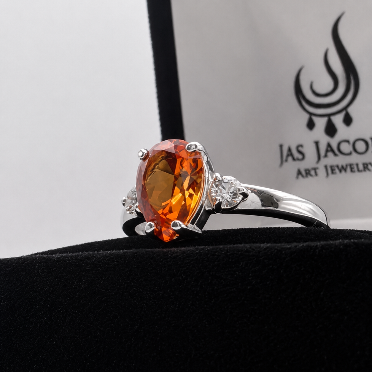 2.5CTW Pear Cut Padparadscha Sapphire Ring with White Sapphire Accents