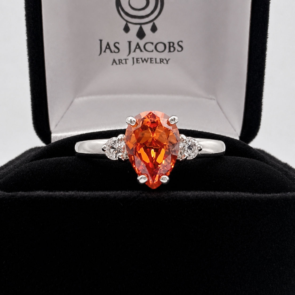2.5CTW Pear Cut Padparadscha Sapphire Ring with White Sapphire Accents