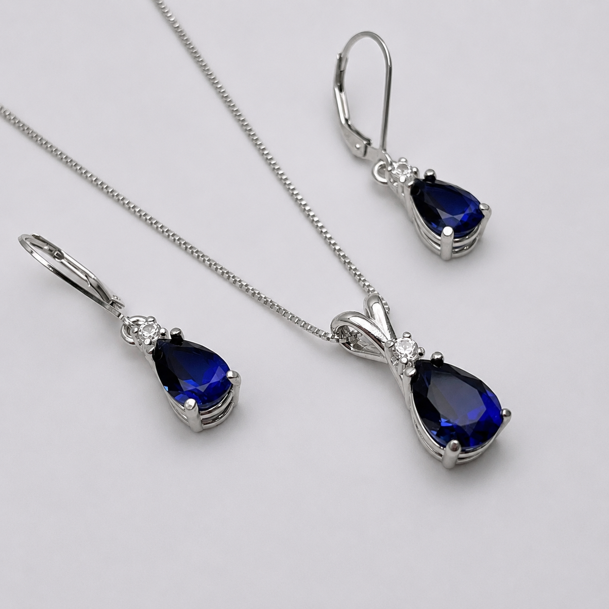 5.5 CTW Pear Cut Blue & White Sapphire Jewelry Set