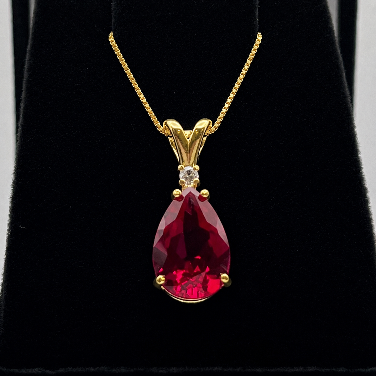 7.5ct Pear Cut Ruby Pendant Necklace with Diamond Accent in 14k Gold