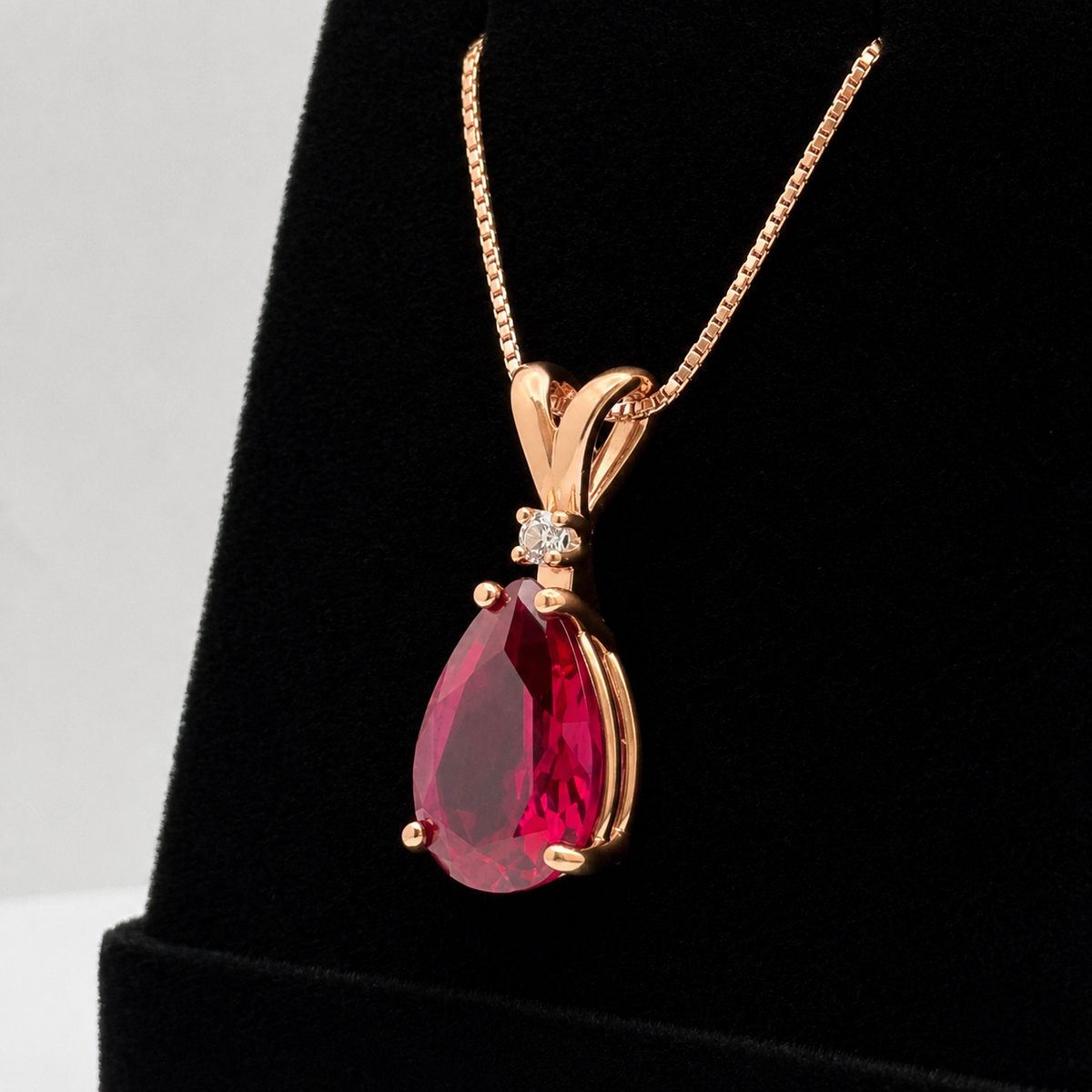 7.5ct Pear Cut Ruby Pendant Necklace with Diamond Accent in 14k Gold