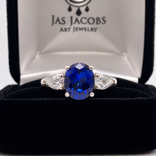 4.5ctw Oval Blue Sapphire & White Sapphire Three Stone Ring