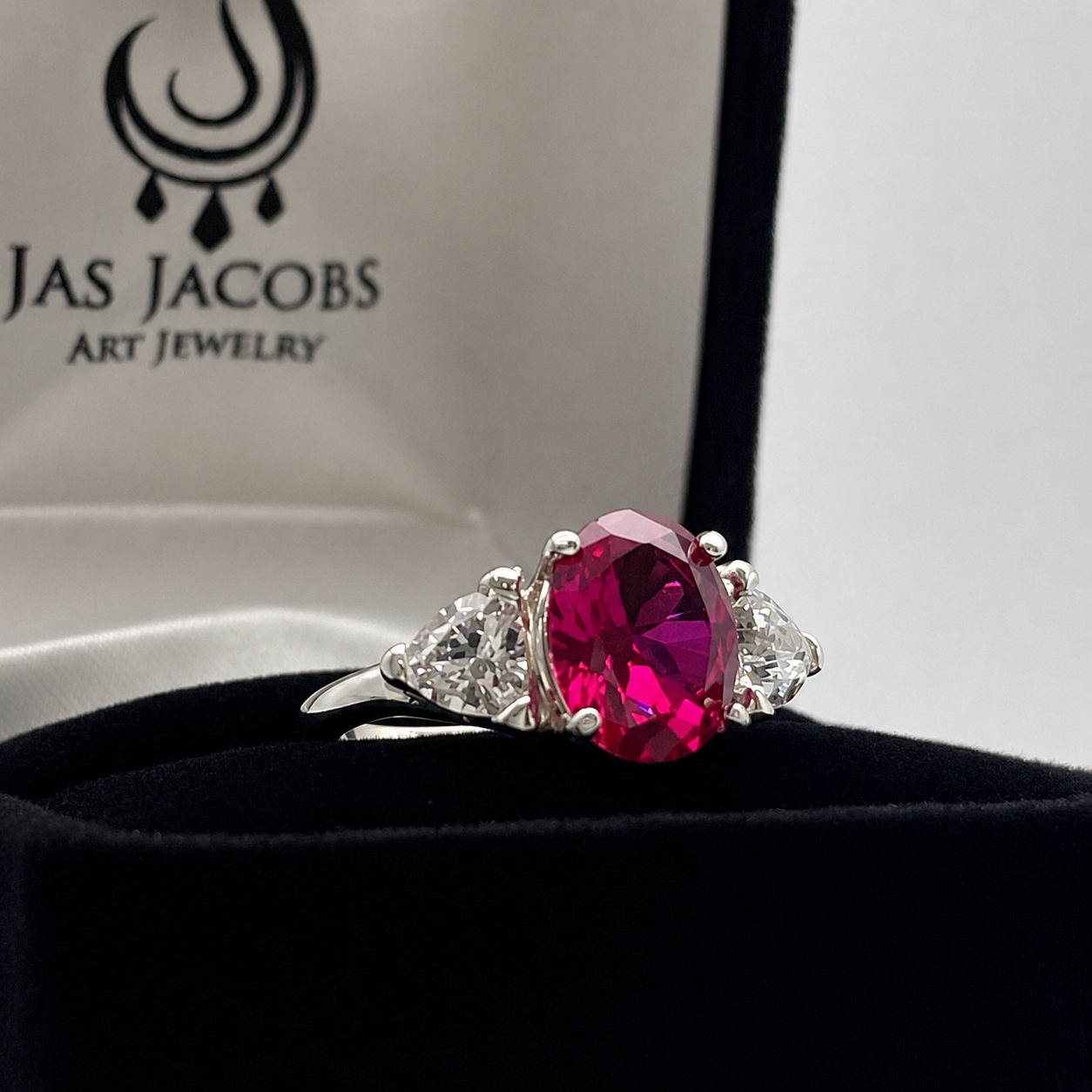 4.5ctw Oval Cut Ruby & Trillion Cut White Sapphire Three Stone Ring