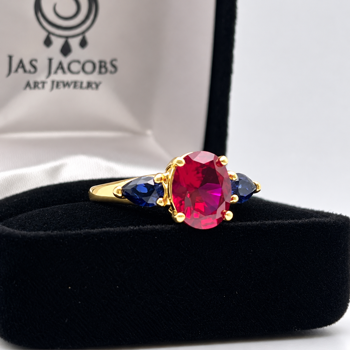 4.5ctw Oval Ruby & Blue Sapphire Three-Stone Statement Ring