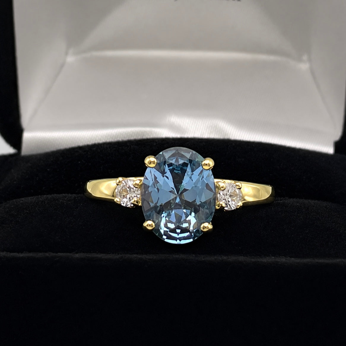 2.6CTW Oval Cut Blue Topaz Ring | White Sapphire Accents