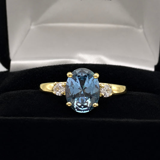 2.6CTW Oval Cut Blue Topaz Ring | White Sapphire Accents