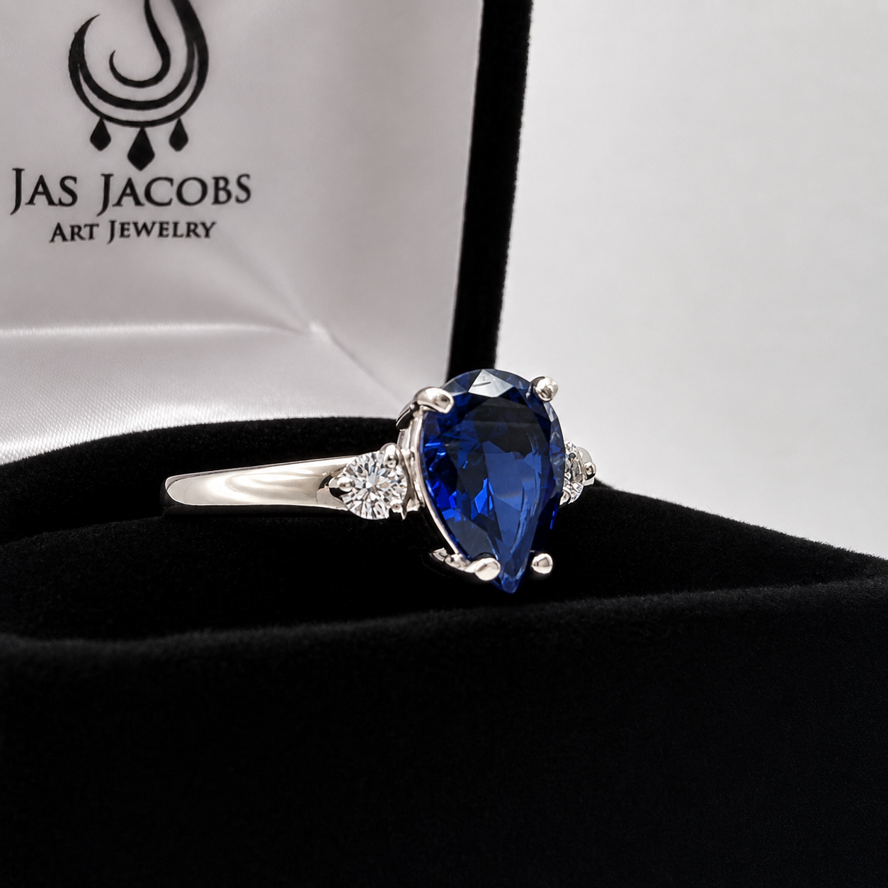 2.5CTW Pear Cut Sapphire Ring with White Sapphire Accents