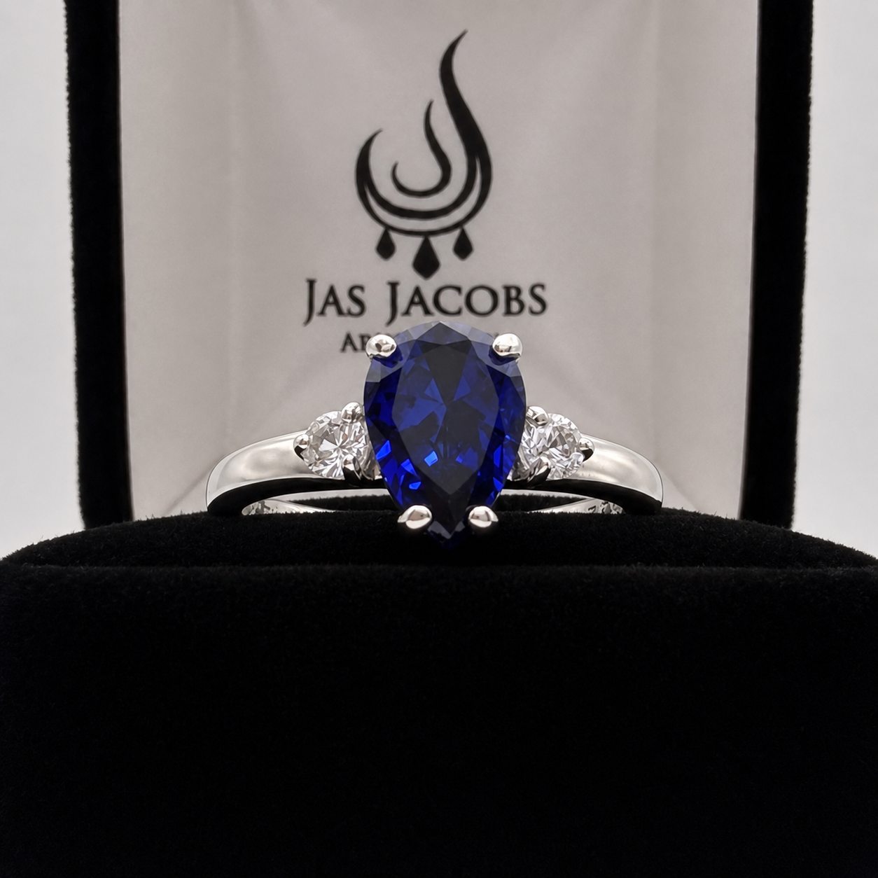 2.5CTW Pear Cut Sapphire Ring with White Sapphire Accents