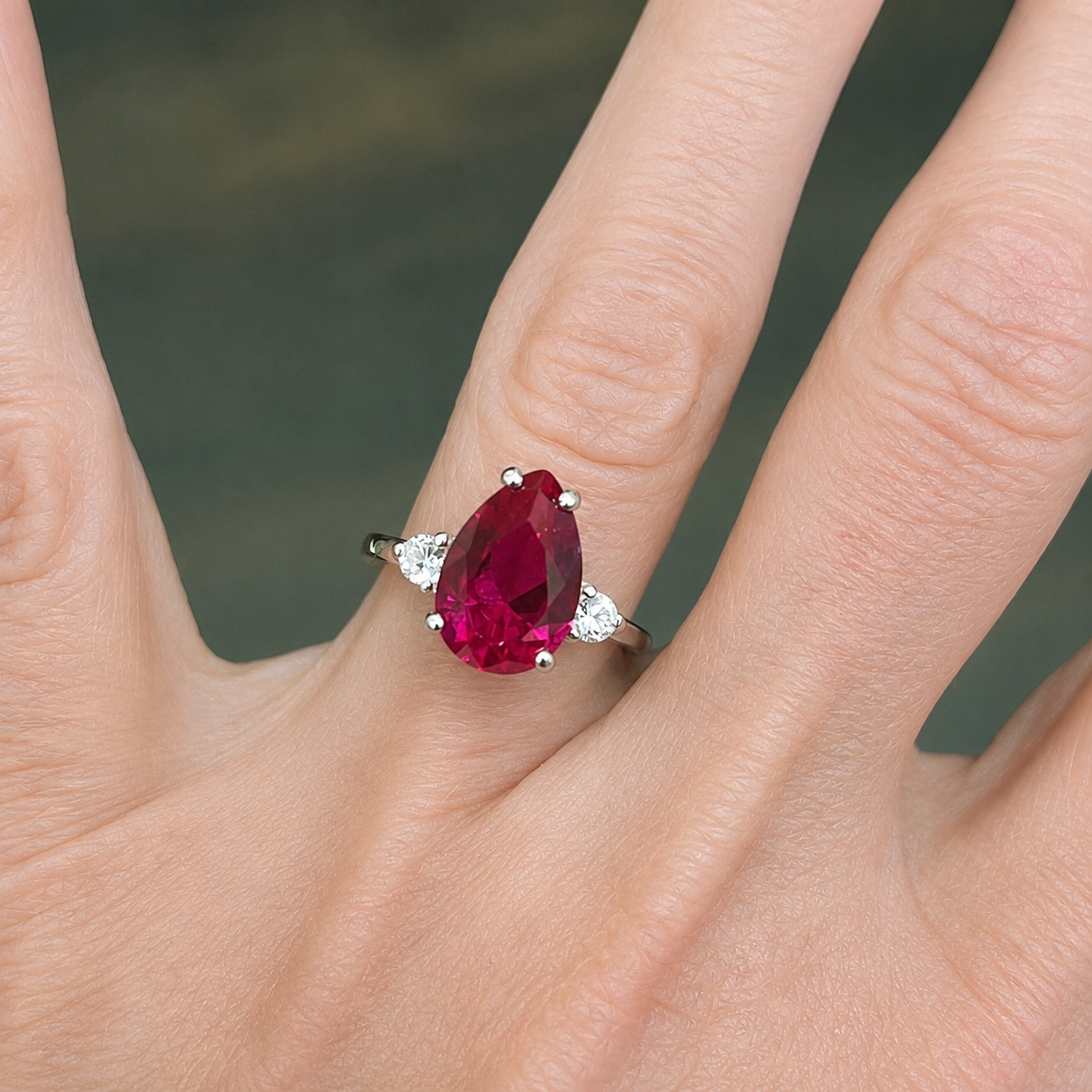 4.7CTW Pear Cut Ruby Ring with White Sapphire Accents