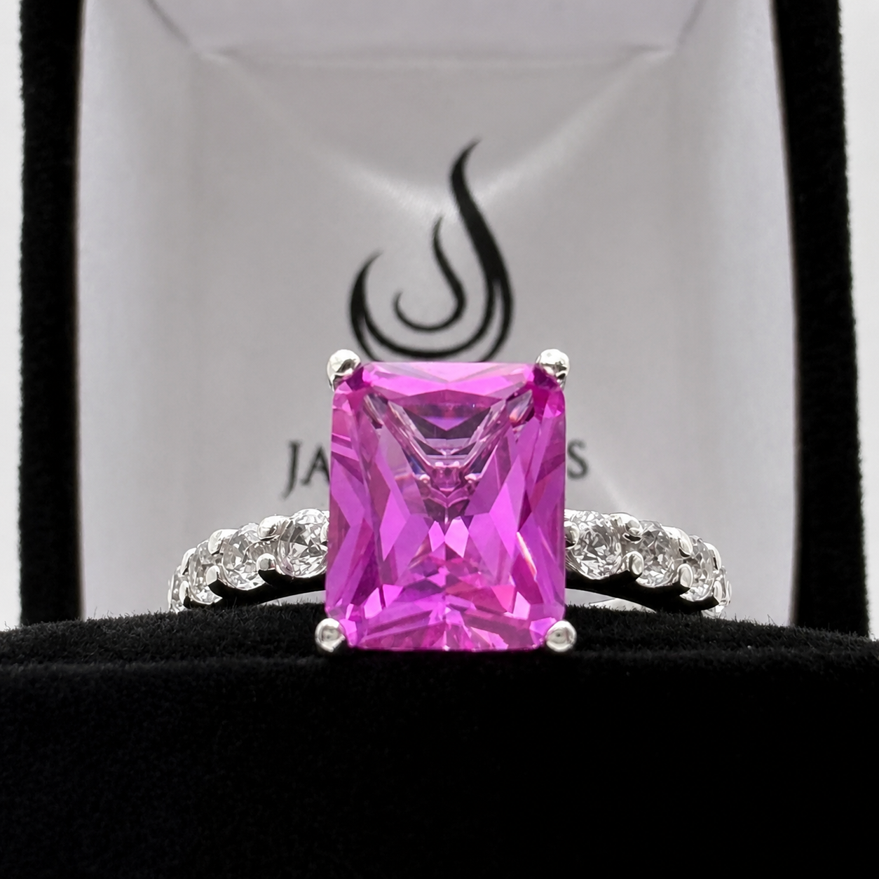 4.64CTW Emerald Cut Pink Sapphire Ring with 8 Brilliant Diamond Accents