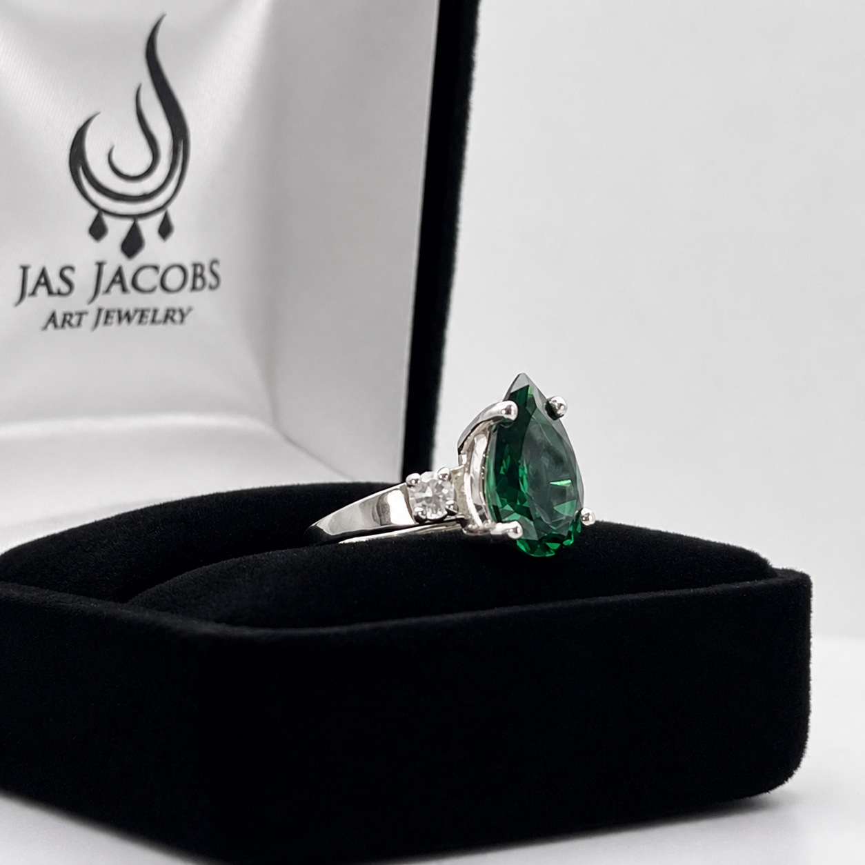 3.7CTW Pear Cut Emerald Ring with White Sapphire Accents