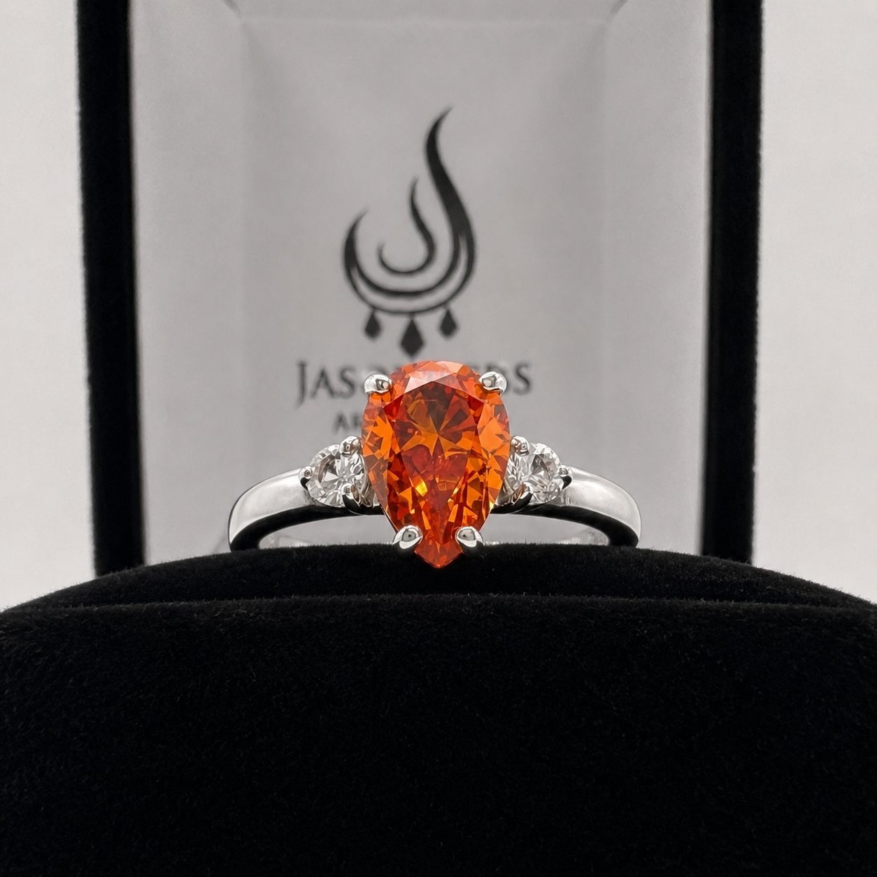 2.5CTW Pear Cut Padparadscha Sapphire Ring with White Sapphire Accents