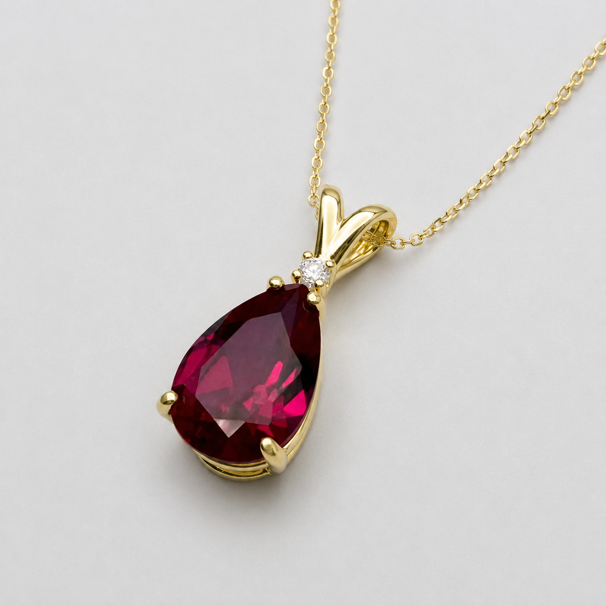 7.5ct Pear Cut Ruby Pendant Necklace with White Sapphire Accent