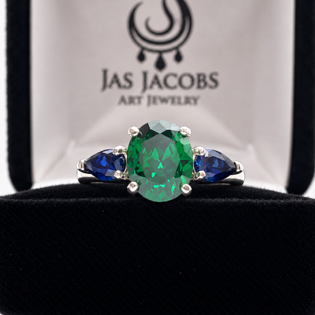 3.6ctw Oval Emerald & Pear Blue Sapphire Three Stone Ring