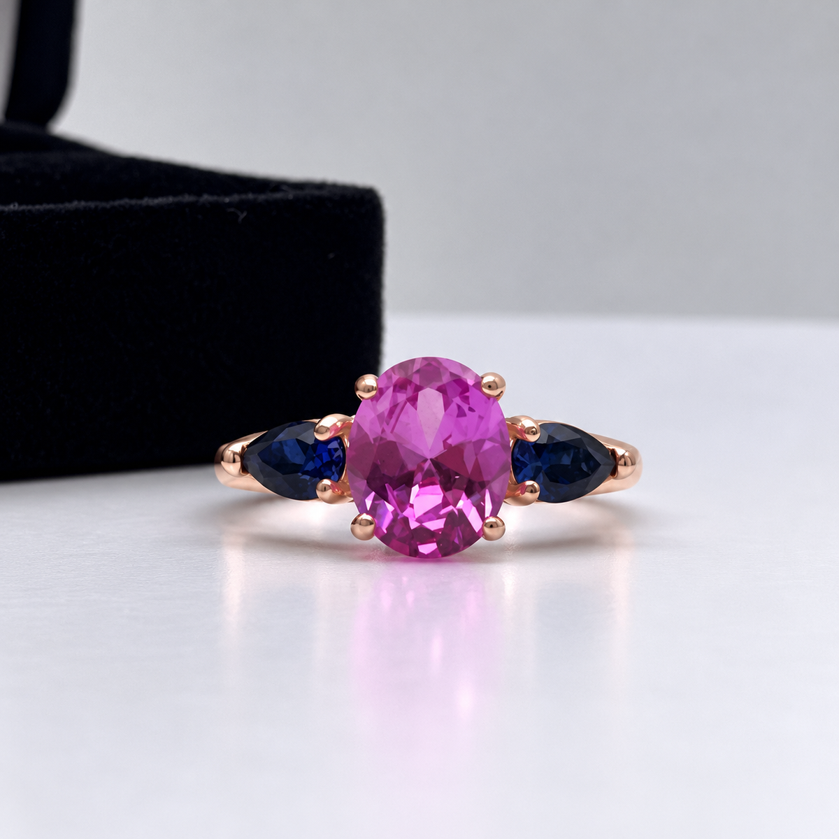 4.5ctw Oval Cut Pink & Blue Sapphire Three-Stone Ring
