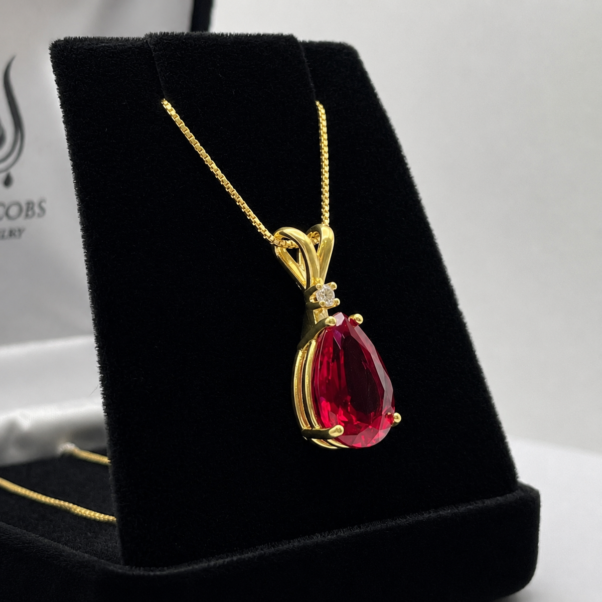 7.5ct Pear Cut Ruby Pendant Necklace with Diamond Accent in 14k Gold