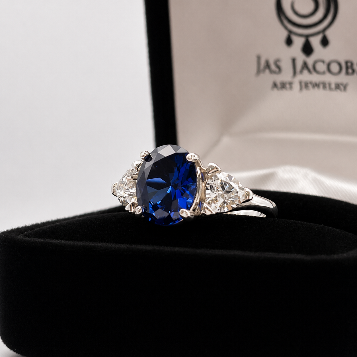 4.5ctw Oval Cut Blue Sapphire Three Stone Ring | Trillion Cut White Sapphires