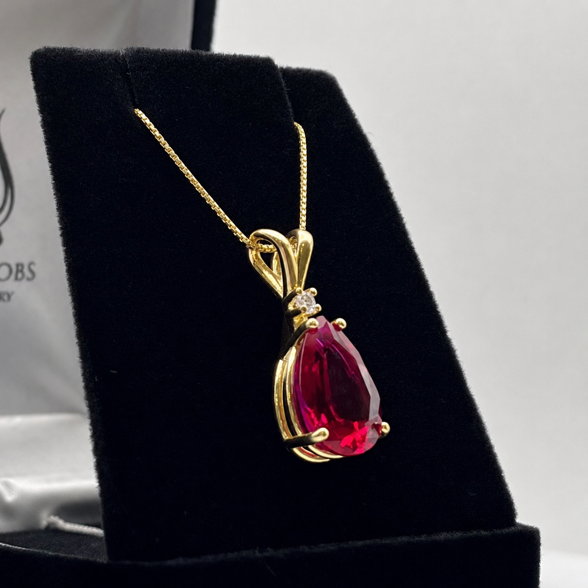 7.5ct Pear Cut Ruby Pendant Necklace with Diamond Accent in 14k Gold