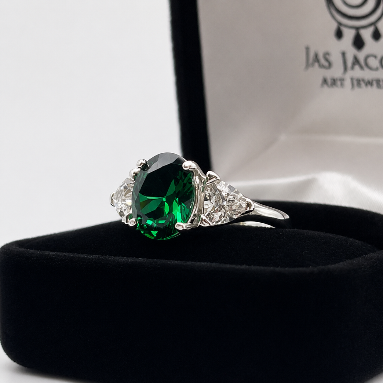 4ctw Oval Cut Lab Grown Emerald & Trillion White Sapphire Three Stone Ring