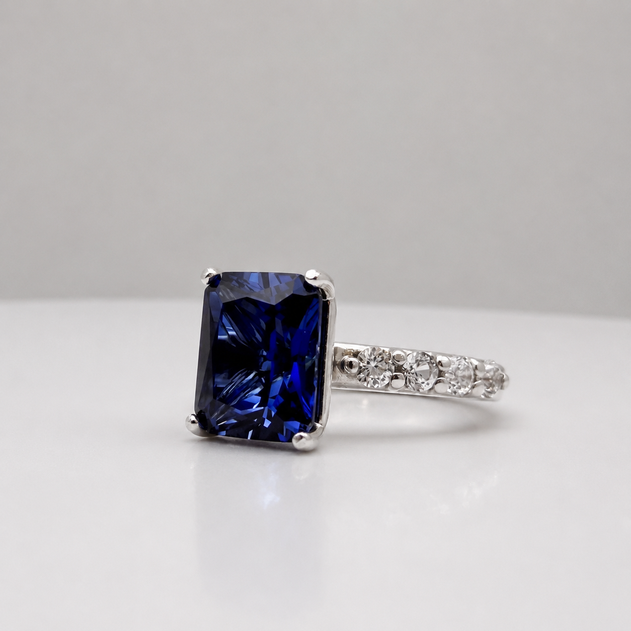4.64 Carat Emerald Cut Blue Sapphire Ring with Diamond Accents